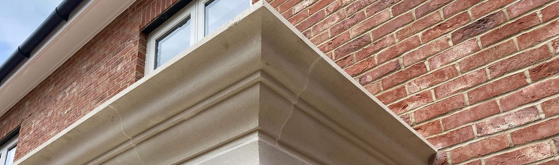 Architectural stone cornice brick facade