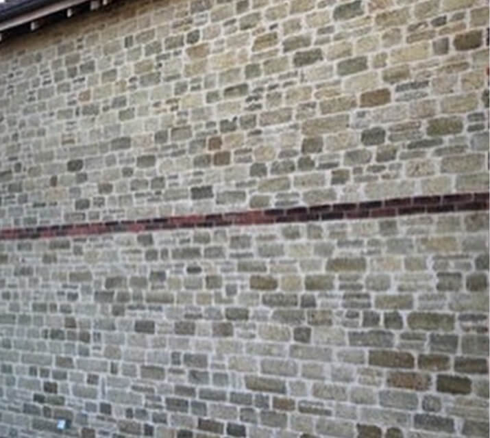 Coursed rubble stone wall